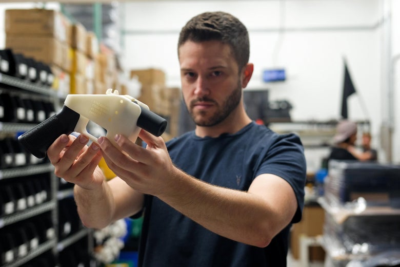Cody Wilson, owner of Defense Distributed company, holds a 3D printed gun, called the "Liberator."